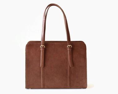 A brown leather laptop bag with two handles and metal hardware, displayed against a white background.
