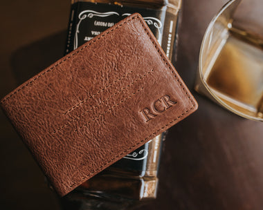 Full grain brown leather wallet with a hot stamped monogram
