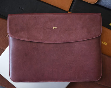 Burgundy wine leather laptop sleeve with a gold monogram